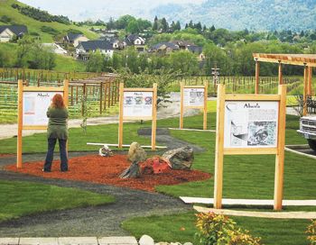 A guest reads informational signs
along the Winegrower’s Walk at the brand new Abacela Vine and Wine Center in Winston.
Photo by Hanna Jones.