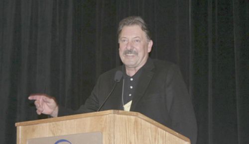 Lonnie Wright, of the Pines 1852 in the Columbia Gorge, receives the Lifetime Achievement Award from the Oregon Wine Board at this year s Oregon Wine Symposium.  Photo courtesy of OWB.