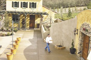Dan Marca moves a case of wine to DANCIN Vineyards’ cave for storage. Dan Marca moves a case of wine to DANCIN Vineyards’ cave for storage.