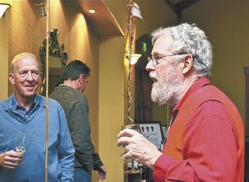 Myron Redford of Amity Vineyards talks with a guest at this year’s Equinox, Eola-Amity Hills Winegrowers Association’s annual tasting event.