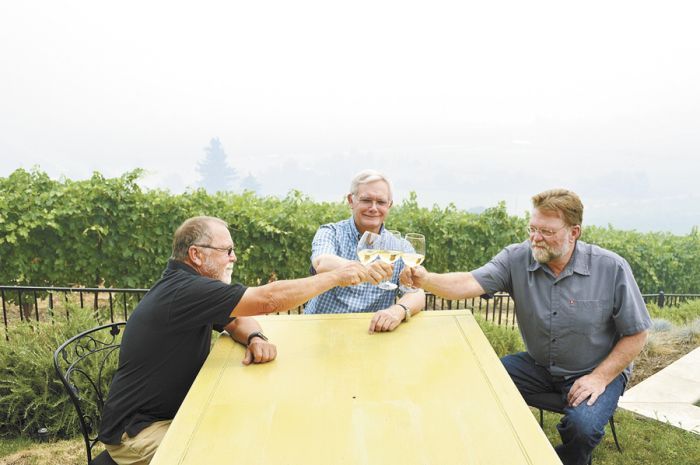 Rogue Valley growers Cal Schmidt, Lee Mankin and Joe Ginet hope for the best despite smoke lingering over Southern Oregon vineyards such as Mankin’s Carpenter Hill Vineyard in Medford. Photo by Janet Eastman. Rogue Valley growers Cal Schmidt, Lee Mankin and Joe Ginet hope for the best despite smoke lingering over Southern Oregon vineyards such as Mankin’s Carpenter Hill Vineyard in Medford. Photo by Janet Eastman.
