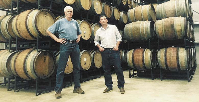 Bill Holloran (left) and winemaker Mark La Gasse prepare the new winery in the Dundee Hills, where Holloran Wines will now be produced. ##Photo by Neil Zawicki