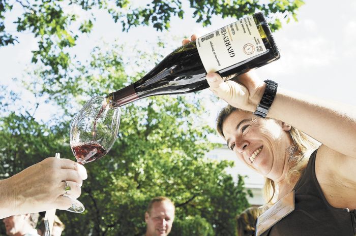 Alexandrine Roy of Phelps Creek in Hood River pours Pinot from Gevrey-Chambertin in Burgundy, her other employer and homebase. Photo by Marcus Larson. Alexandrine Roy of Phelps Creek in Hood River pours Pinot from Gevrey-Chambertin in Burgundy, her other employer and homebase. Photo by Marcus Larson.