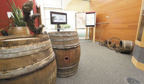 French oak aging barrels and an antique wine press are part of Linfield’s Oregon wine
history exhibit, “Bringing Vines to the Valley.” Photo by Marcus Larson.