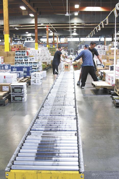 Frequently ordered items stand adjacent to the main conveyer line at the OLCC’s 230,000-square-foot warehouse in Southeast Portland. Photo provided. Frequently ordered items stand adjacent to the main conveyer line at the OLCC’s 230,000-square-foot warehouse in Southeast Portland. Photo provided.