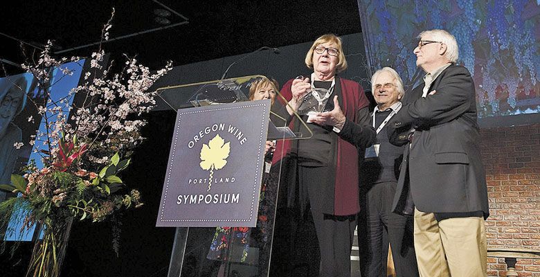 Sue Horstmann accepts the 2017 Lifetime Achievment Award presented by David Adelsheim and Harry Peterson-Nedry at the Oregon Wine Symposium at the Oregon Convention Center in Portland. ##Photo by Carolyn Wells Kramer  
