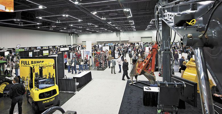 Trade show participants chat with industry members. ##Photo by Carolyn Wells Kramer  