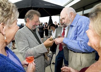 Dick Ponzi (left) and Dick Erath chat before the dinner begins. Photo by Marcus Larson.