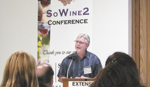 Michael Donovan speaks to attendees at SoWine 2, June 14 in Central Point.