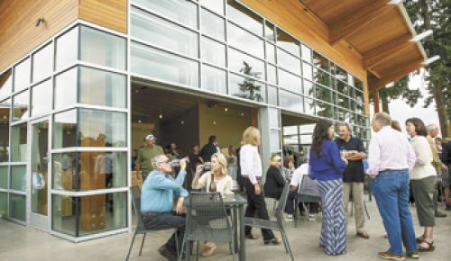 Guests gather on the patio at the new Stoller tasting room in Dayton during its grand opening on Sept. 9.