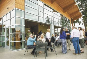 Guests gather on the patio at the new Stoller tasting room in Dayton during its grand opening on Sept. 9. Guests gather on the patio at the new Stoller tasting room in Dayton during its grand opening on Sept. 9.