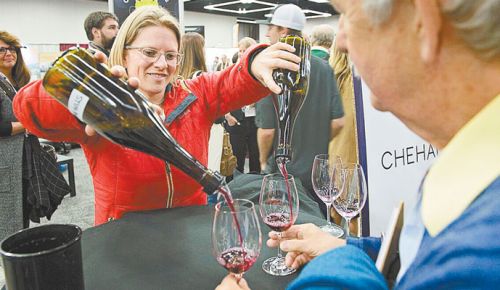 Wynne Peterson-Nedry pours Chehalem Wine during an experimental tasting at this year’s Oregon Wine Symposium. ##Photo by Carolyn Wells-Kramer