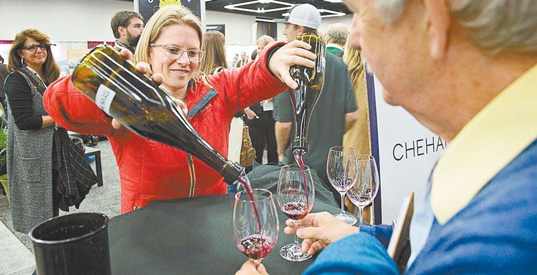 Wynne Peterson-Nedry pours Chehalem Wine during an experimental tasting at this year’s Oregon Wine Symposium. ##Photo by Carolyn Wells-Kramer