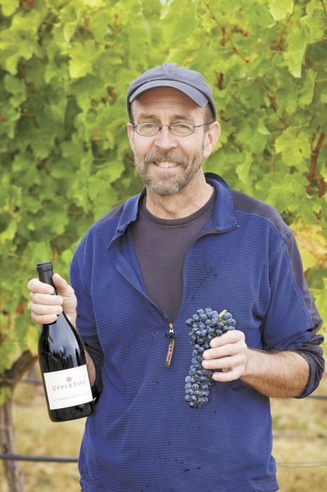 Upper Five owner Terry Cooper Sullivan holds a bottle of Upper Five 2010 Tempranillo, which received 90 points from Wine Spectator. The wine was Sullivan’s first vintage. Photo provided. Upper Five owner Terry Cooper Sullivan holds a bottle of Upper Five 2010 Tempranillo, which received 90 points from Wine Spectator. The wine was Sullivan’s first vintage. Photo provided.