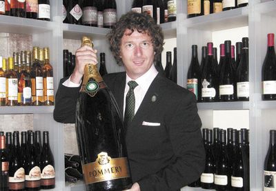 Robert Volz stands in his temperature controlled
cellar above Pour Wine Bar & Bistro in Northeast Portland. Photo provided.