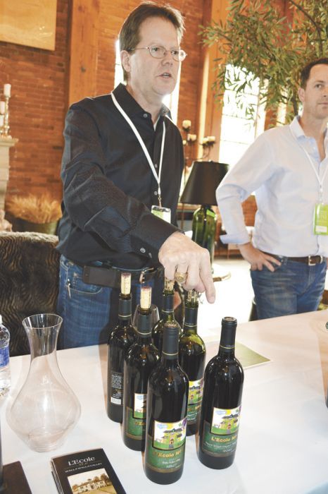 Martin Clubb, owner and managing winemaker of L’Ecole No. 41, pours his wines inside Corliss Estates during the opening reception. Photo by Janet Eastman. Martin Clubb, owner and managing winemaker of L’Ecole No. 41, pours his wines inside Corliss Estates during the opening reception. Photo by Janet Eastman.