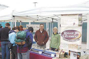 Francis Plowman, Rogue Creamery marketing director and his wife, Gail, give guests samples of the Southern Oregon creamery’s cheese at last year’s event.