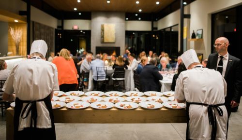 Teknisk Skole Silkeborg hospitality instructor Per Sondergaard oversees his students as they put final touches on the cheese course. ##Photo by Justin Lee