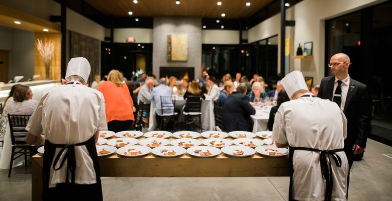 Teknisk Skole Silkeborg hospitality instructor Per Sondergaard oversees his students as they put final touches on the cheese course. ##Photo by Justin Lee