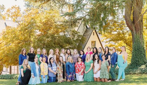 Meghann Walk, a former teacher and now Hummingbird Estate’s general manager (far left, standing) with a group of educators. The winery and inn supports teachers and educators with discounts. ## Photo by Brennan Hamrin
