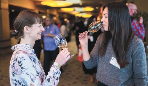 Guests at the Chardonnay Celebration enjoy samples offered at the 2022 event. ##Photo by Josh Chang