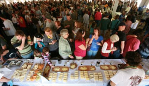 Guests taste samples from the state s different creameries.  Photos by Rory Finney.