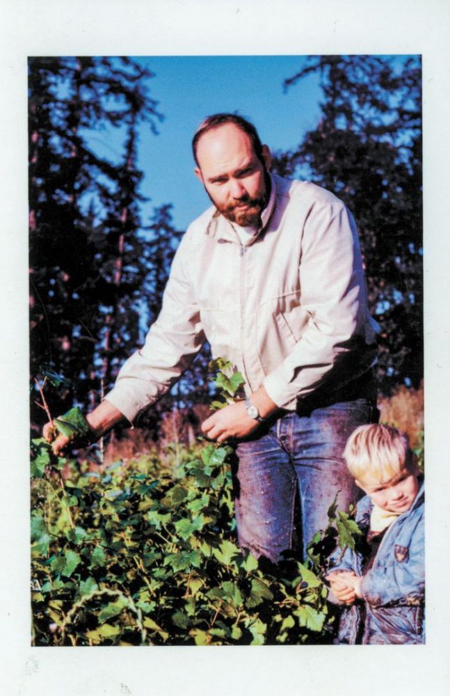 Dick Erath stands with his son, Cal, in the vineyard nursery behind the logger’s cabin on Kings Grade Road in Newberg.##Erath Winery Collection. Jereld R. Nicholson Library, Linfield university. Donated by Dick Erath, 2012 Dick Erath stands with his son, Cal, in the vineyard nursery behind the logger’s cabin on Kings Grade Road in Newberg.##Erath Winery Collection. Jereld R. Nicholson Library, Linfield university. Donated by Dick Erath, 2012