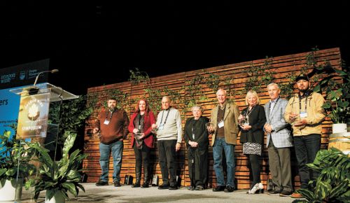 From left to right: Vineyard Excellence Award winner Pedro Martinez, Industry Partner Award winner Jackie Crawford, Industry Founder’s Award winner Dr. Robert Gross, Outstanding Industry Leadership Award winners Drs. Jeanne and David Beck, Lifetime Achievement Award winners Danuta and Robin Pfeiffer, and Vineyard Excellence Award winner Alejandro Avalos.##Photo by Carolyn Wells-Kramer