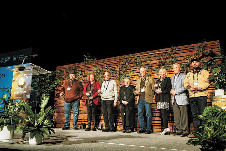 From left to right: Vineyard Excellence Award winner Pedro Martinez, Industry Partner Award winner Jackie Crawford, Industry Founder’s Award winner Dr. Robert Gross, Outstanding Industry Leadership Award winners Drs. Jeanne and David Beck, Lifetime Achievement Award winners Danuta and Robin Pfeiffer, and Vineyard Excellence Award winner Alejandro Avalos.##Photo by Carolyn Wells-Kramer