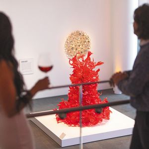 Two women admiring art while drinking wine at the museum. ## Photo By Kitta Bodmer