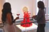 Two women admiring art while drinking wine at the museum. ## Photo By Kitta Bodmer