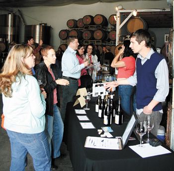 Nic Donahue, owner/winemaker of Alchemy Wine Productions based in Portland, pours samples of his latest wines. Photo by Jennifer Cossey