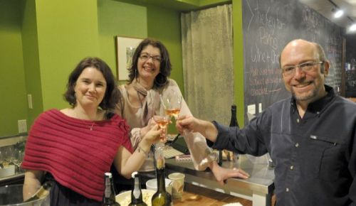 Pairings Portland owners Jeffrey Weissler (right) and Megan Wilkerson (left) toast the new wine shop with friend Beverly McKenzie, a fellow wine aficionado.