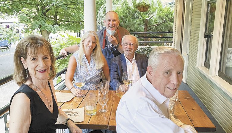 Photographer Andrea Johnson’s parents, Marsha and Mark Hagg (front), join Andrea (left) and photographer Robert Holmes for a meal at Paley’s Place with Vitaly Paley joining the table for a moment. ##Photo provided by Andrea Johnson
