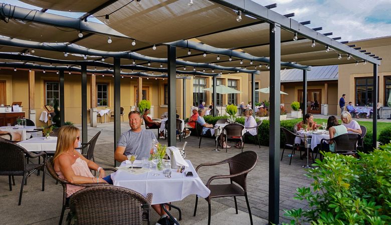 The patio at The Dundee Bistro buzzes with customers enjoying dinner outside. ##Photo provided.