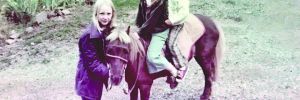 Michele and her brother sitting on her pony Pepper ## Photo by Michele Francisco