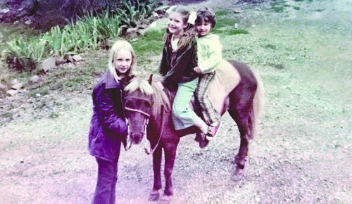 Michele and her brother sitting on her pony Pepper ## Photo by Michele Francisco