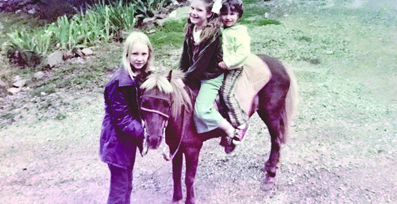 Michele and her brother sitting on her pony Pepper ## Photo by Michele Francisco
