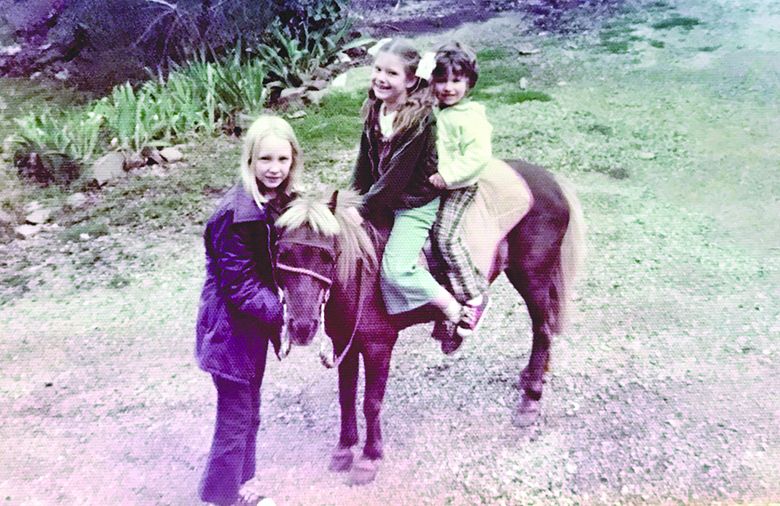 Michele and her brother sitting on her pony Pepper ## Photo by Michele Francisco