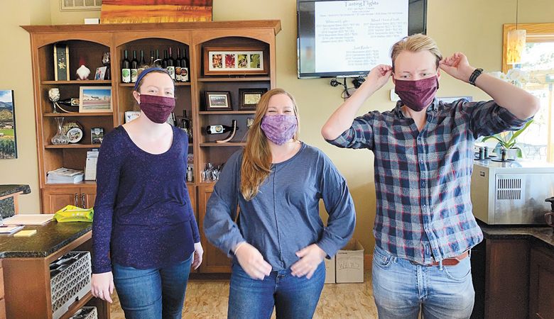 Tasting room staff members wear masks at Dana Campbell Vineyards in Ashland.  ##Photo provided