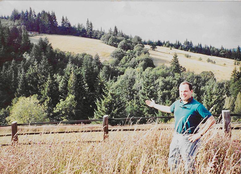 A young Bob gesturing to a slope destined to be planted with grapevines. ## Photo provided by Phelps Creek Vineyards A young Bob gesturing to a slope destined to be planted with grapevines. ## Photo provided by Phelps Creek Vineyards