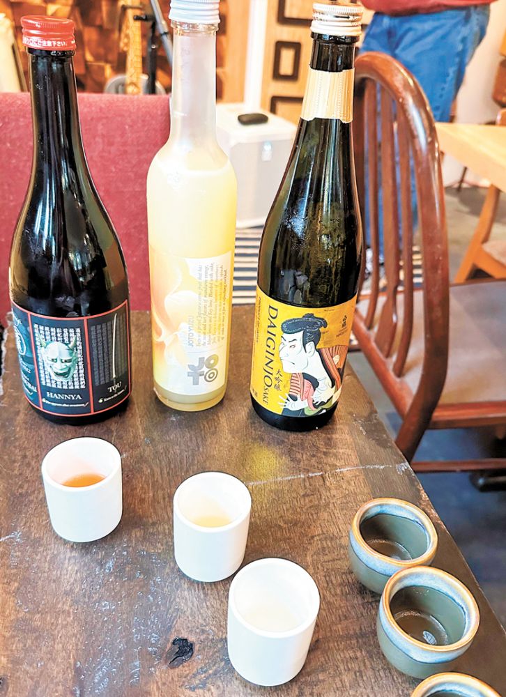 Flight two first provides tasters with a more traditional Daiginjo, then two very unique, unexpected sakés; Joto Yuzu, infused with fruit, and Hannya, infused with plum wine and chili peppers.##Photo by Paula Bandy
