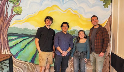 Acorn to Oak staff, from left: James Litton, Victor Sandoval, Alyssa Sepulveda and Paul Johnson standing in front of the mural by Allison Hmura.##Photo by Neal D. Hulkower