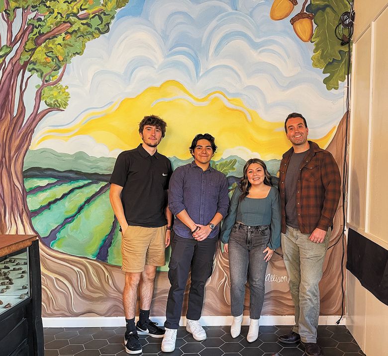Acorn to Oak staff, from left: James Litton, Victor Sandoval, Alyssa Sepulveda and Paul Johnson standing in front of the mural by Allison Hmura.##Photo by Neal D. Hulkower Acorn to Oak staff, from left: James Litton, Victor Sandoval, Alyssa Sepulveda and Paul Johnson standing in front of the mural by Allison Hmura.##Photo by Neal D. Hulkower