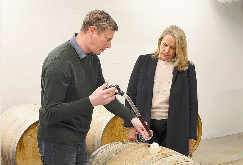 James Osborne pulling a sample of Pinot Noir from a barrel in the OSU winery with OSU Agriculture Dean Staci Simonich. ## Photo provided by Oregon State University