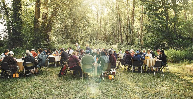 Guests enjoy a gourmet dinner as part of the Pinot Paddle experience. ##Photo by Kathyrn Elsesser