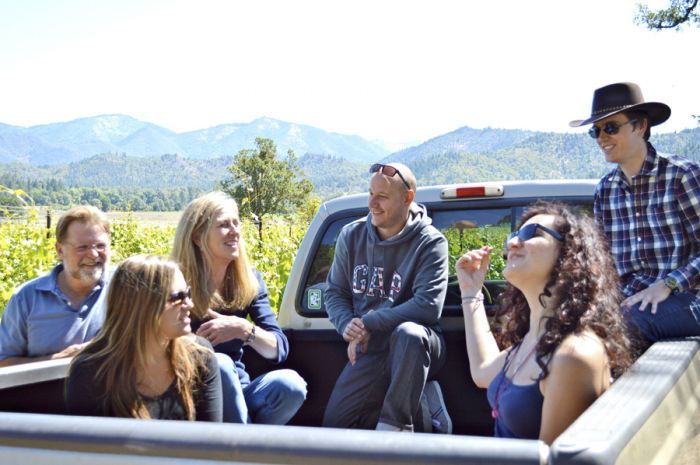 Joe and Suzi Ginet of Plaisance Ranch in Williams give French visitors, from left, Vaite Redolat, Cedric Buffet, Julie Laforet and Bruno Carle, their first trip in a pickup on the way to work in the vineyards. Photo courtesy of Mail Tribune/Janet Eastman. Joe and Suzi Ginet of Plaisance Ranch in Williams give French visitors, from left, Vaite Redolat, Cedric Buffet, Julie Laforet and Bruno Carle, their first trip in a pickup on the way to work in the vineyards. Photo courtesy of Mail Tribune/Janet Eastman.