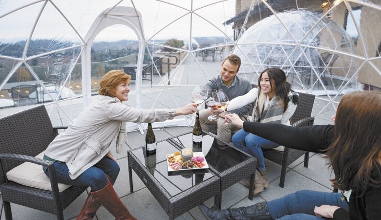 Wineries innovate to maintain or increase sales while keeping safe during the pandemic. For example, at Willamette Valley Vineyards, guests relax inside their own personal cocoons at the Turner estate tasting room.
##Photo by Andrea Johnson