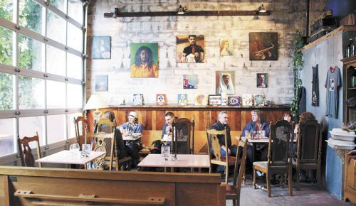 LEFT: Guests relax in the urban-eclectic Hi-Wheel tasting room in Portland. ##Photo provided