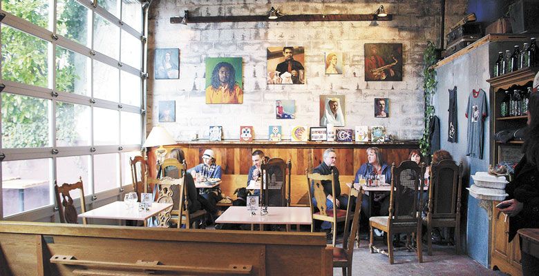 LEFT: Guests relax in the urban-eclectic Hi-Wheel tasting room in Portland. ##Photo provided